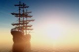 Tramonto sul mare con antica nave a vela